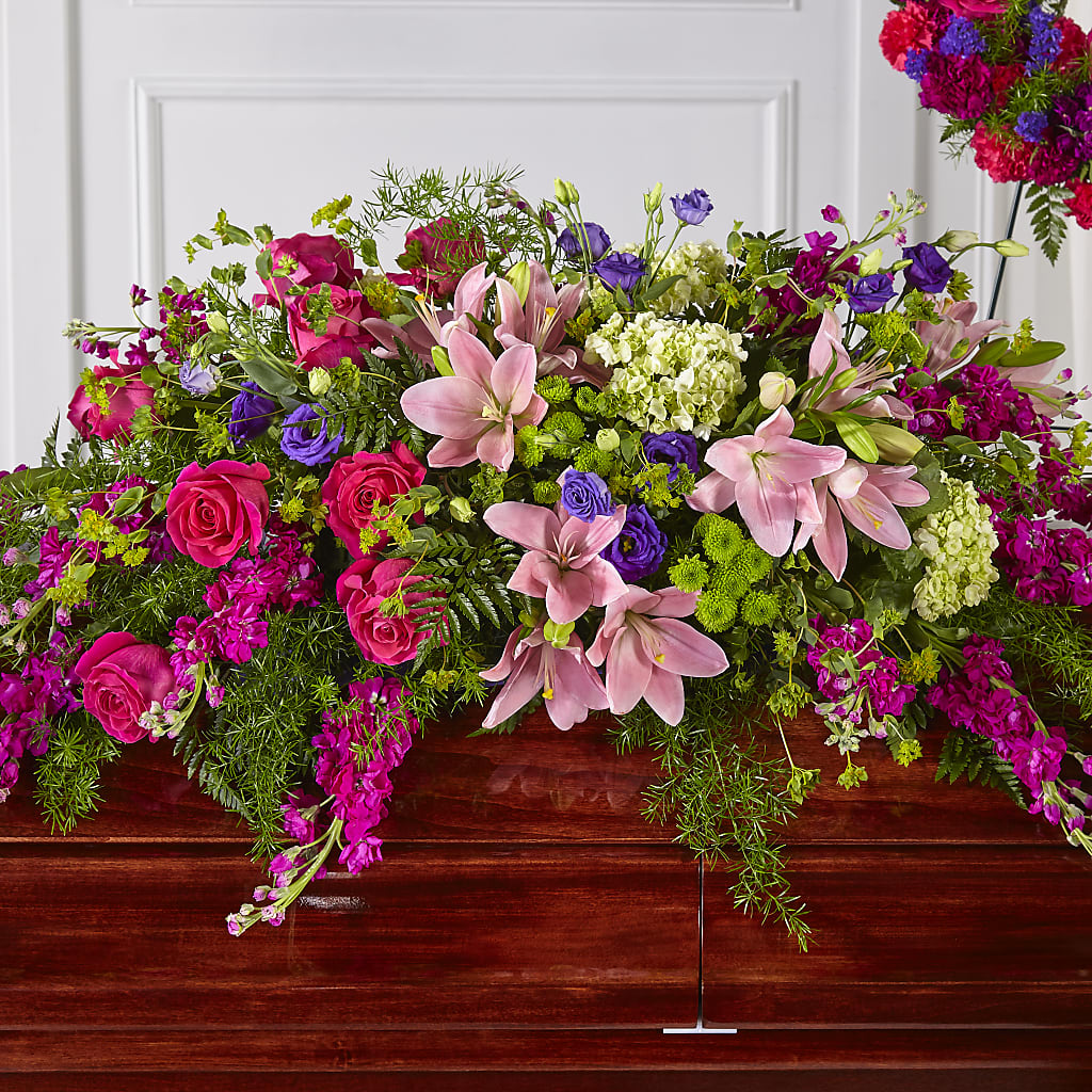 Radiant Tribute Casket Spray – FUZZY'S FLOWERS GIFTS AND TUXEDOS, Marion OH